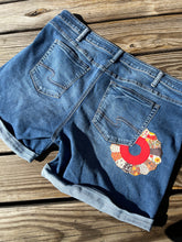 Load image into Gallery viewer, Donut flower Denim shorts size 22
